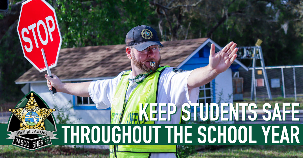 School Crossing Guard with a stop sign, Keep Students Safe Throughout the School Year